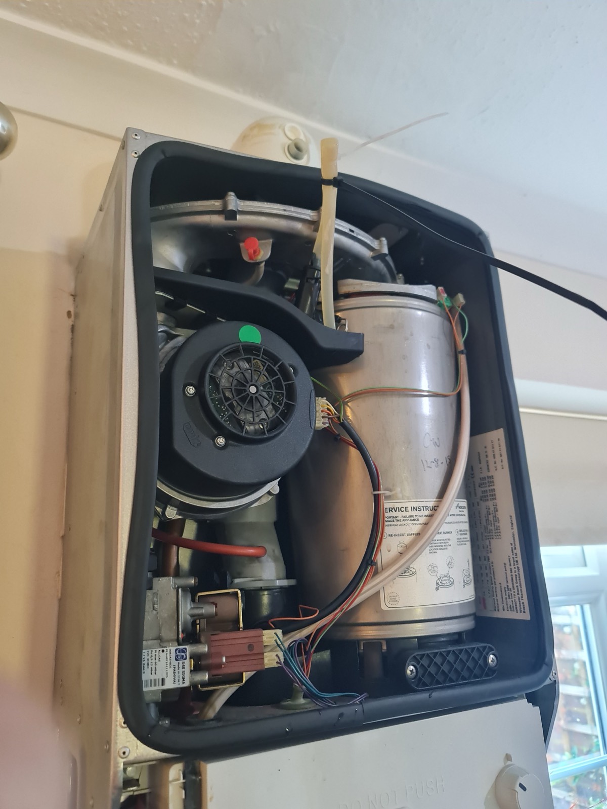 A boiler opened up on a service — fan, heat exchanger and gas valve checked in order rather than parts changed hopefully.